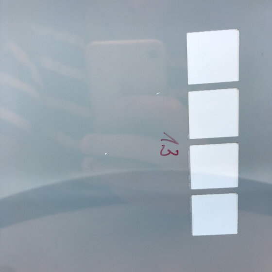 Laser glass coating removal